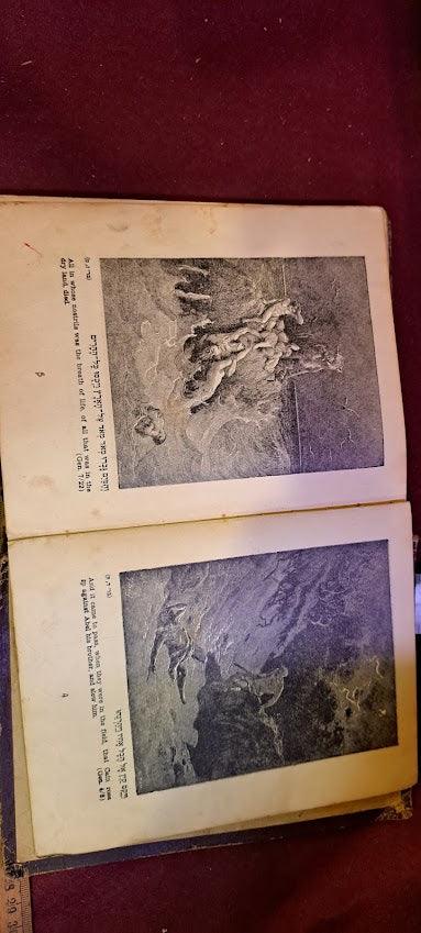 Open antique illustrated book on a red surface, showing two black and white engraved art pages.