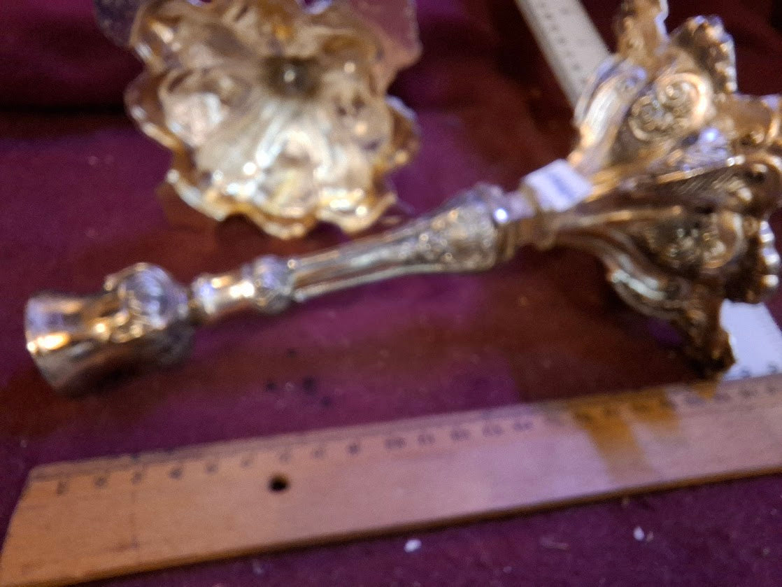 A pair of silver plated candlesticks [JUD10207]