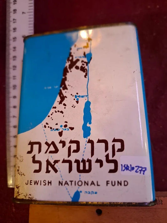 Vintage Jewish National Fund tin box with Hebrew text and Israel map, collectible item.