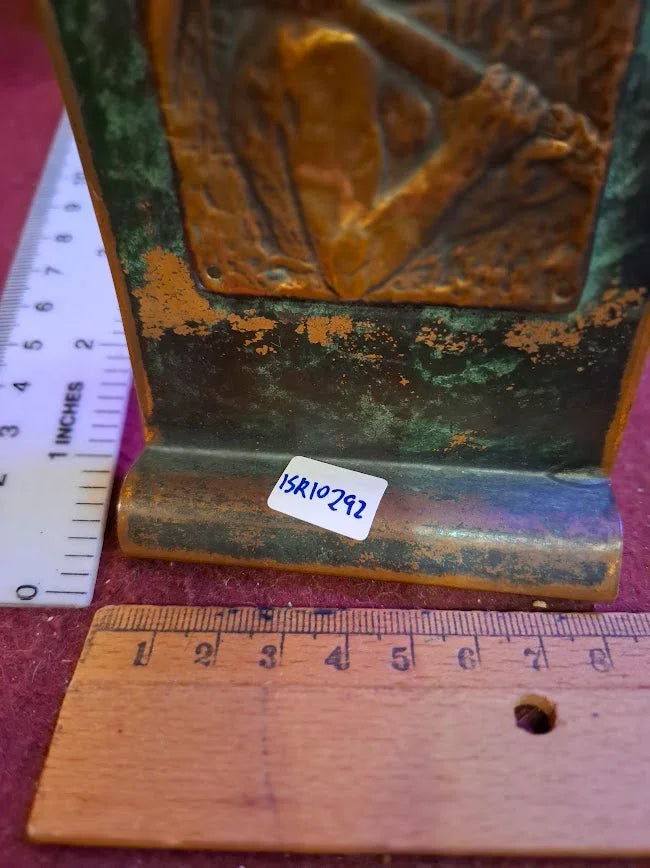 Antique metal bookend with patina, two rulers for scale, collectible decor